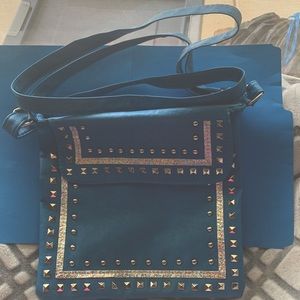 Turquoise and silver studded purse. Never used. Excellent condition.